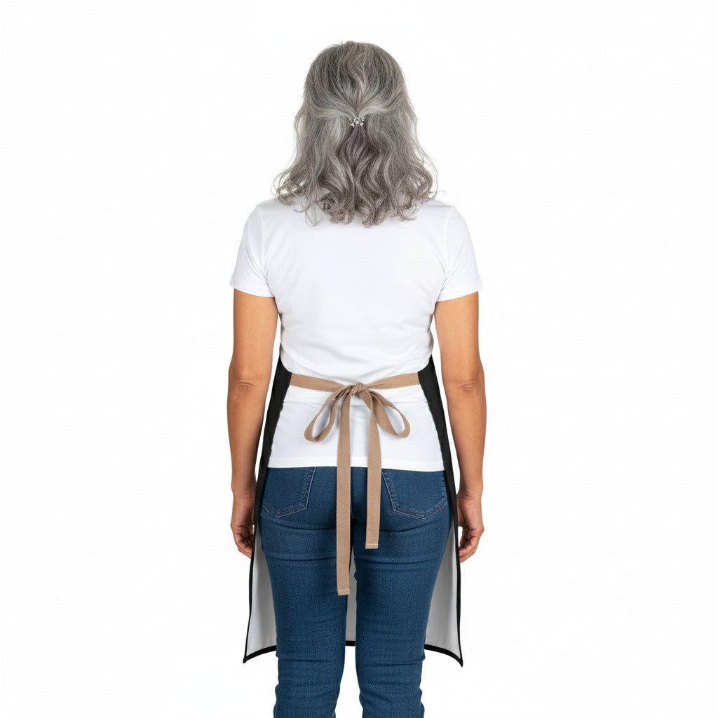 Person wearing a white apron with a brown belt on a white background