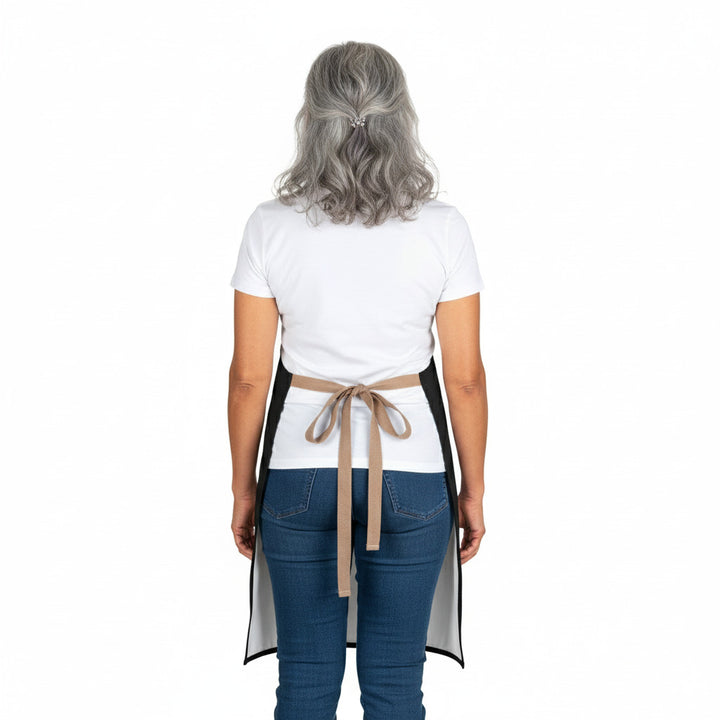 Person wearing a white apron with a brown belt on a white background