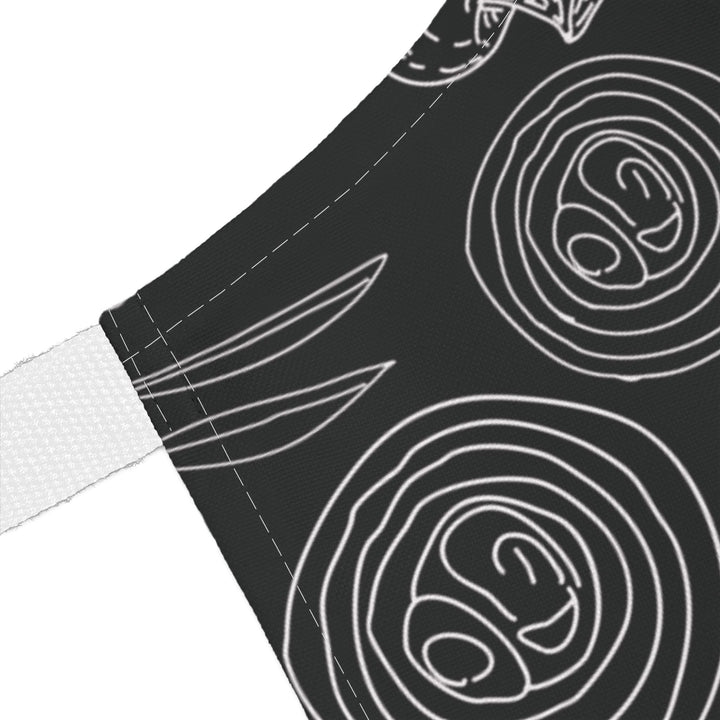 Black fabric with white line art patterns on a white background