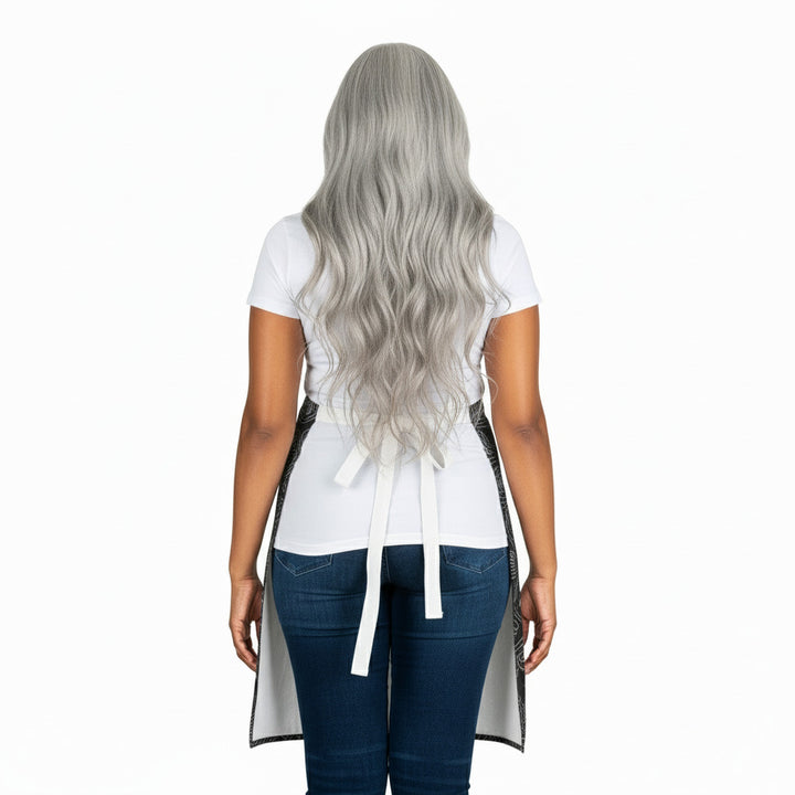 Person wearing a white apron over a white shirt and blue jeans on a white background