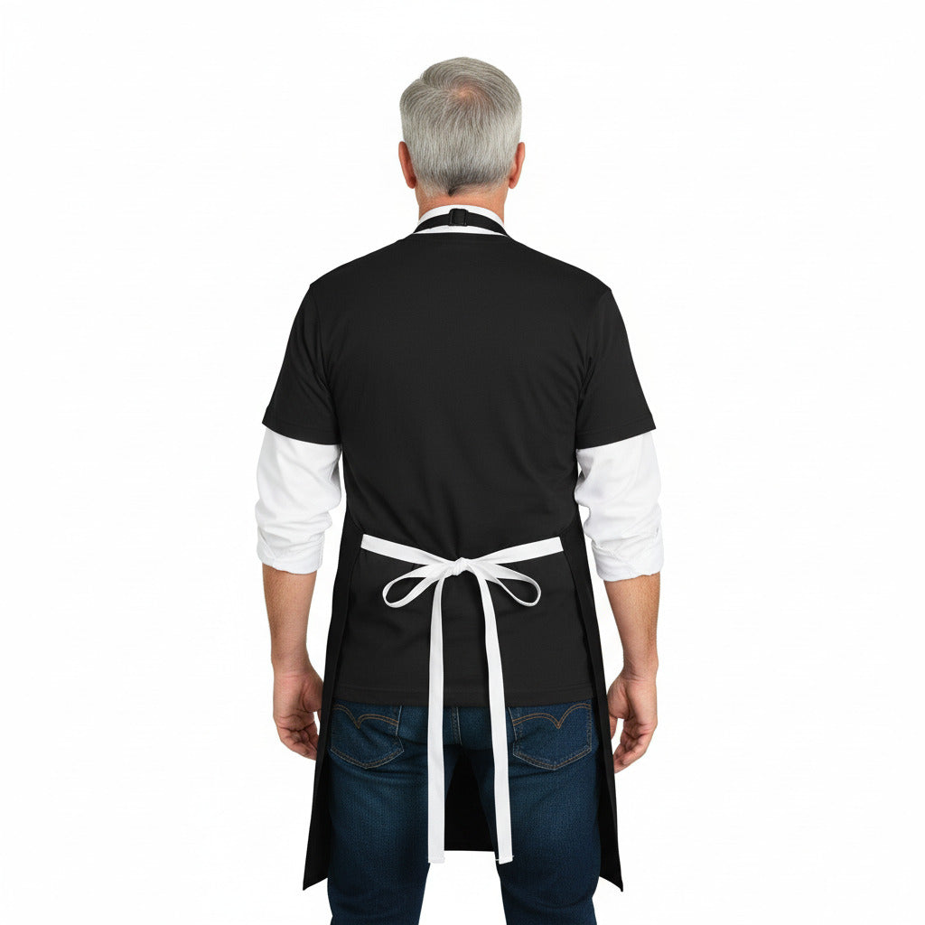 Person wearing a black apron with a white apron over it on a white background