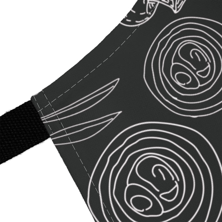 Black fabric with white line art patterns on a white background