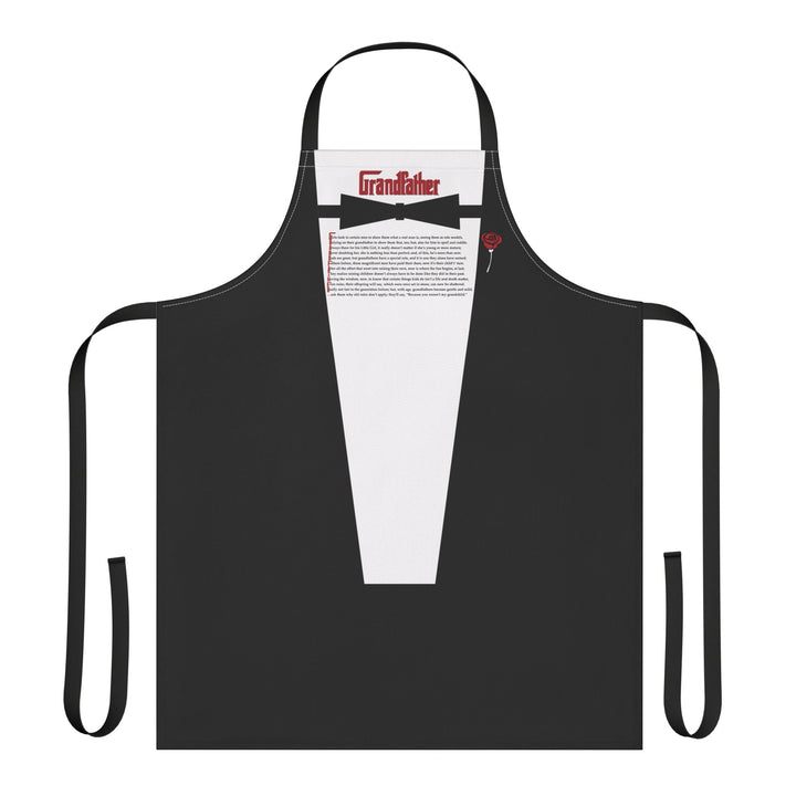 Black apron designed like a tuxedo with a white shirt and red bow tie on a white background.