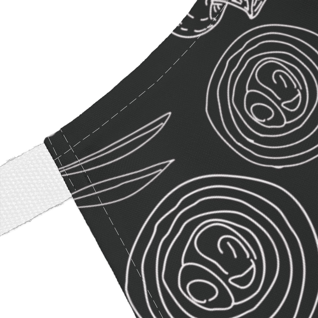Black fabric with white line art patterns on a white background
