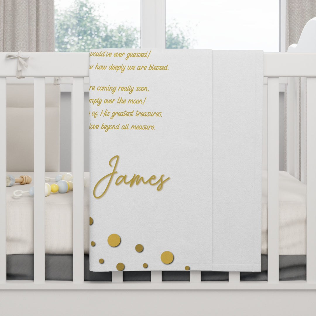 Oh, Baby acrostic poem blanket with gold text and confetti dots on white crib
