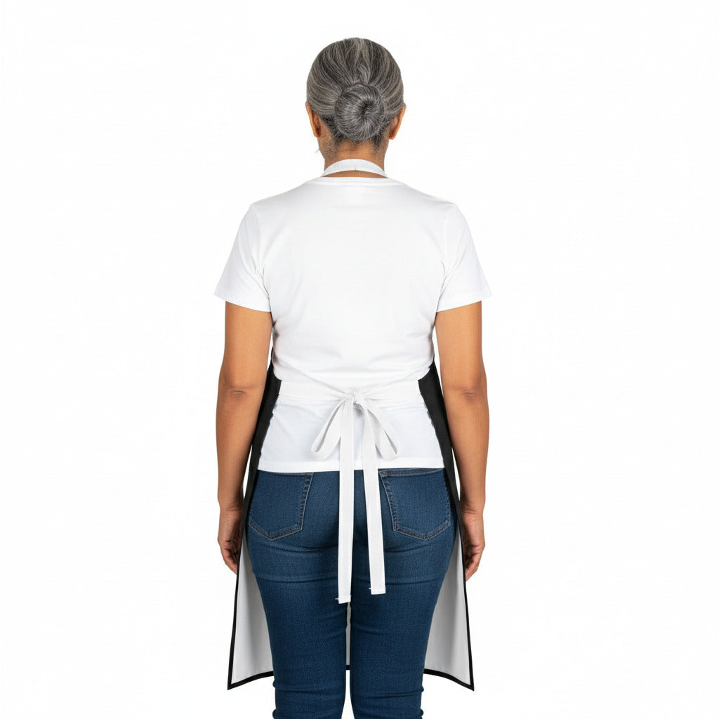 Person wearing a white apron over a white shirt and blue jeans on a white background