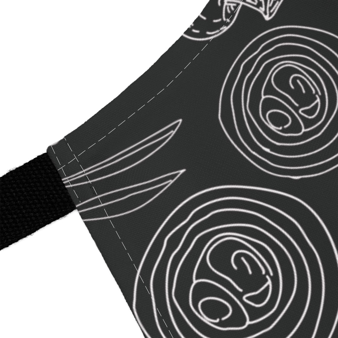 Black fabric with white line art patterns on a white background