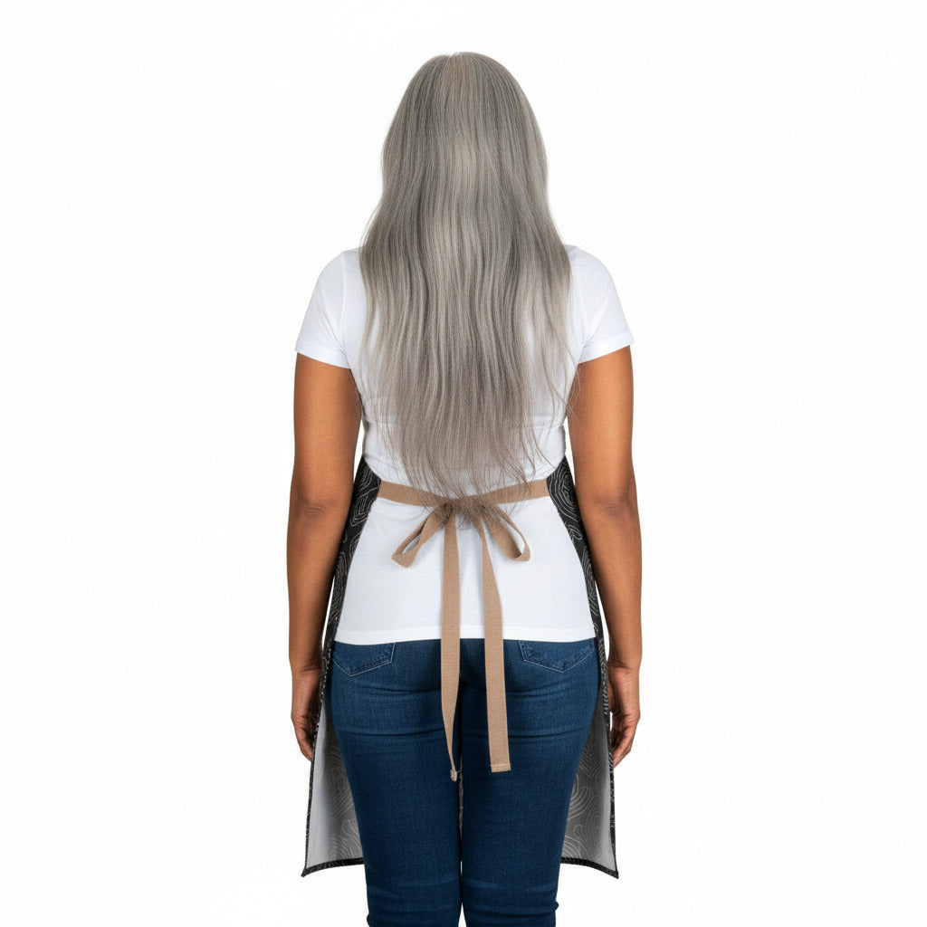 Person wearing a white apron with a beige belt on a white background