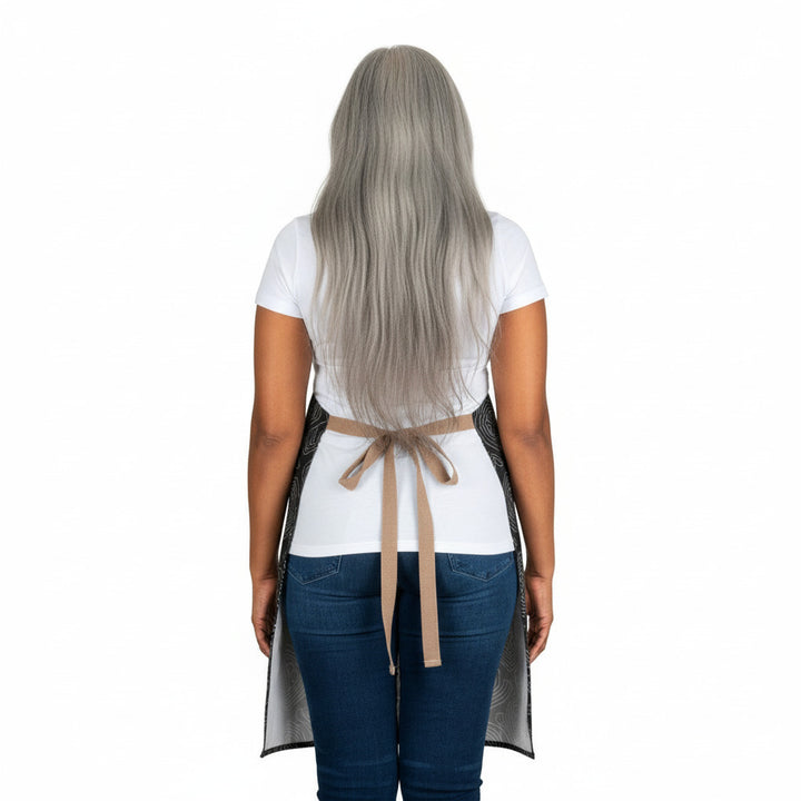 Person wearing a white apron with a beige belt on a white background