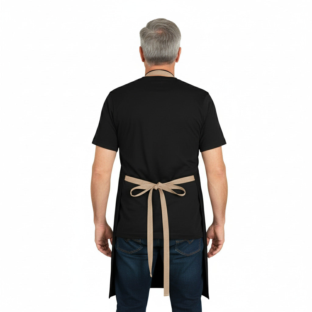 Man wearing a black apron with a beige strap on a white background