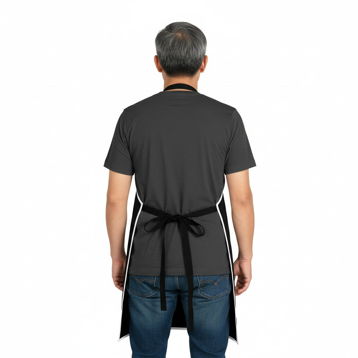Person wearing a black apron on a white background